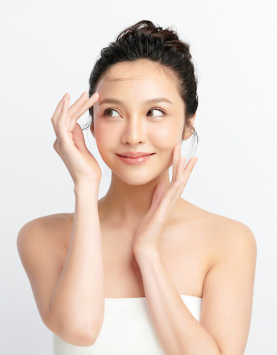 Facial Surgery, female model posing looking to the left, white background